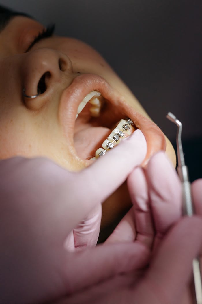 patient receives a treatment from a dentist 6528908
